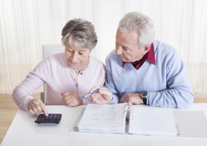 Senior Couple Calculating Budget