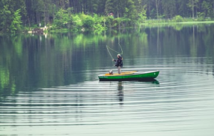 2017-03-11 19_04_28-Person on Green Boat Fishing on Body of Water · Free Stock Photo
