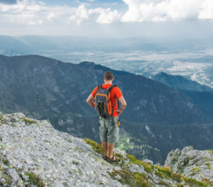 2017-07-02 15_59_43-Gray and Orange Backpack Worn by Man at Mountain · Free Stock Photo