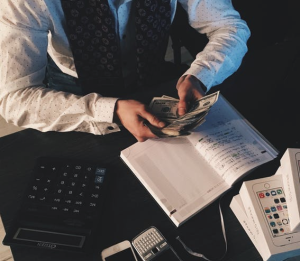 2017-09-17 10_07_10-Person Counting Money With Smartphones in Front on Desk · Free Stock Photo