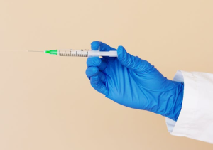 2020-06-27 11_57_21-Crop nurse with syringe on beige background · Free Stock Photo